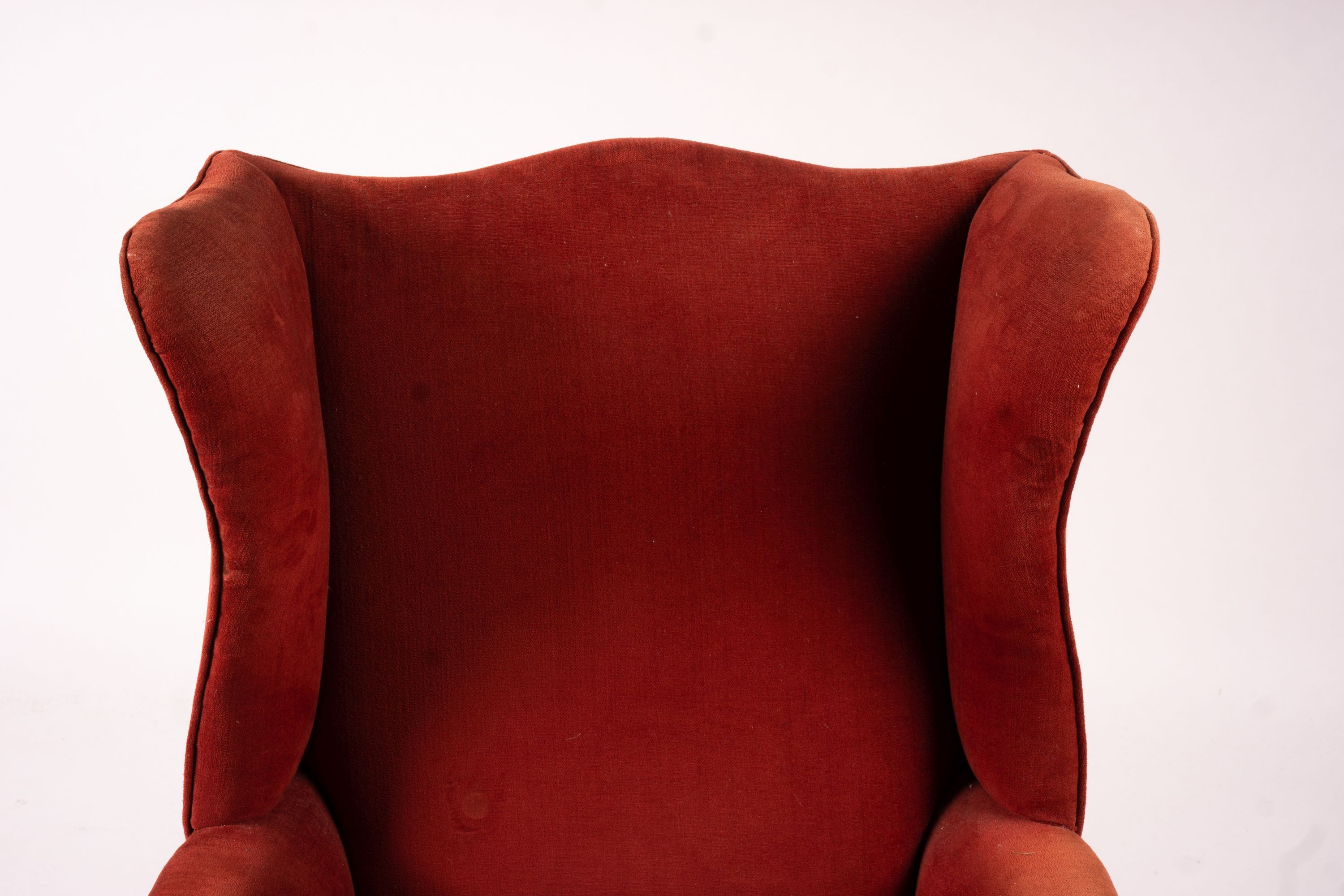 A late Victorian upholstered wing armchair, width 76cm, depth 70cm, height 100cm